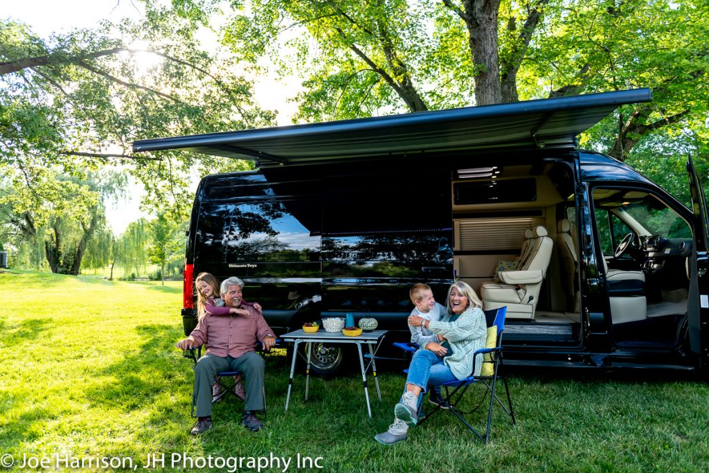 happy family camping outside ultimate RV 