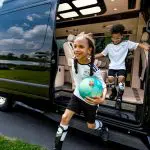 kids running out of ultimate traveler to soccer practice