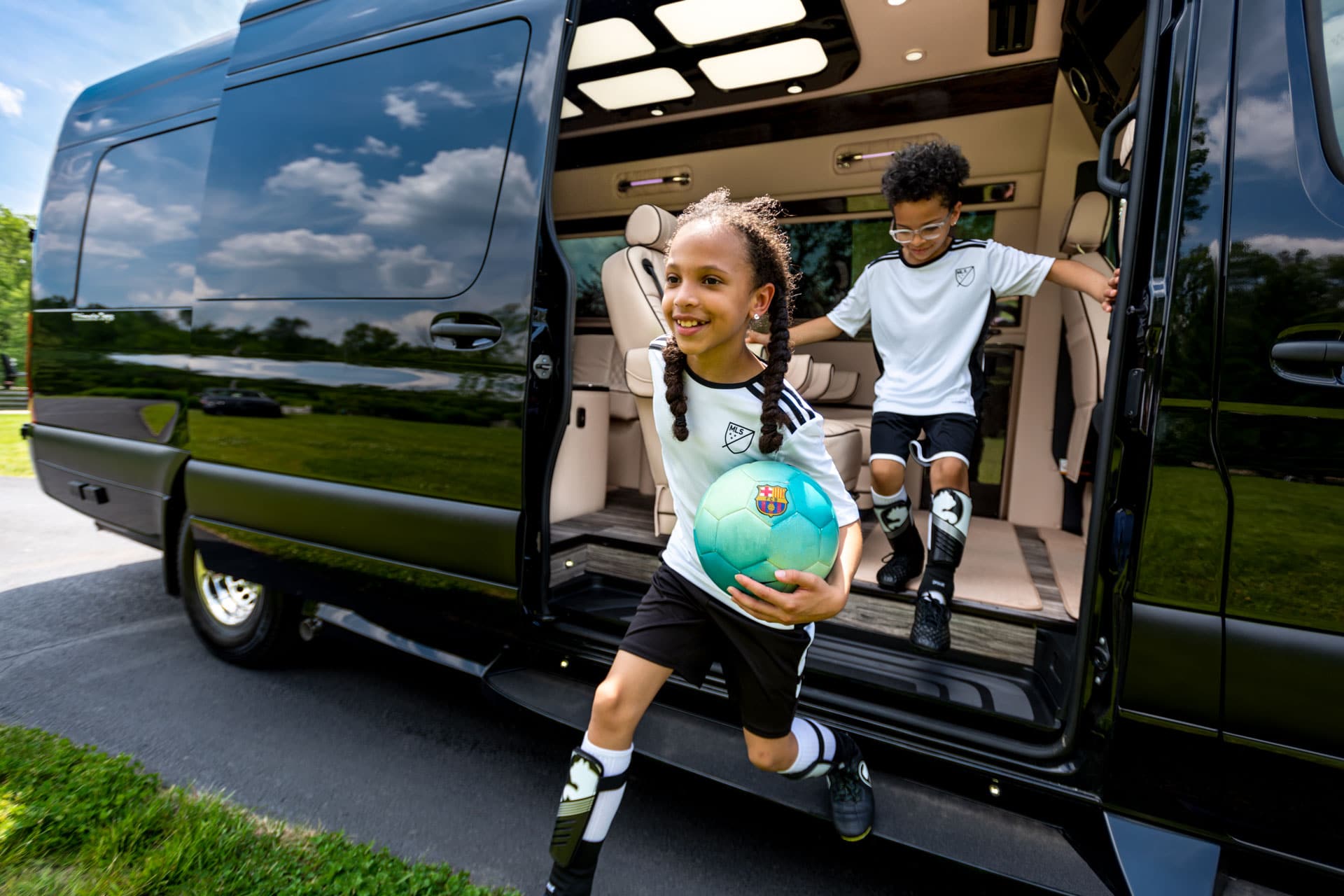 kids running out of ultimate traveler to soccer practice