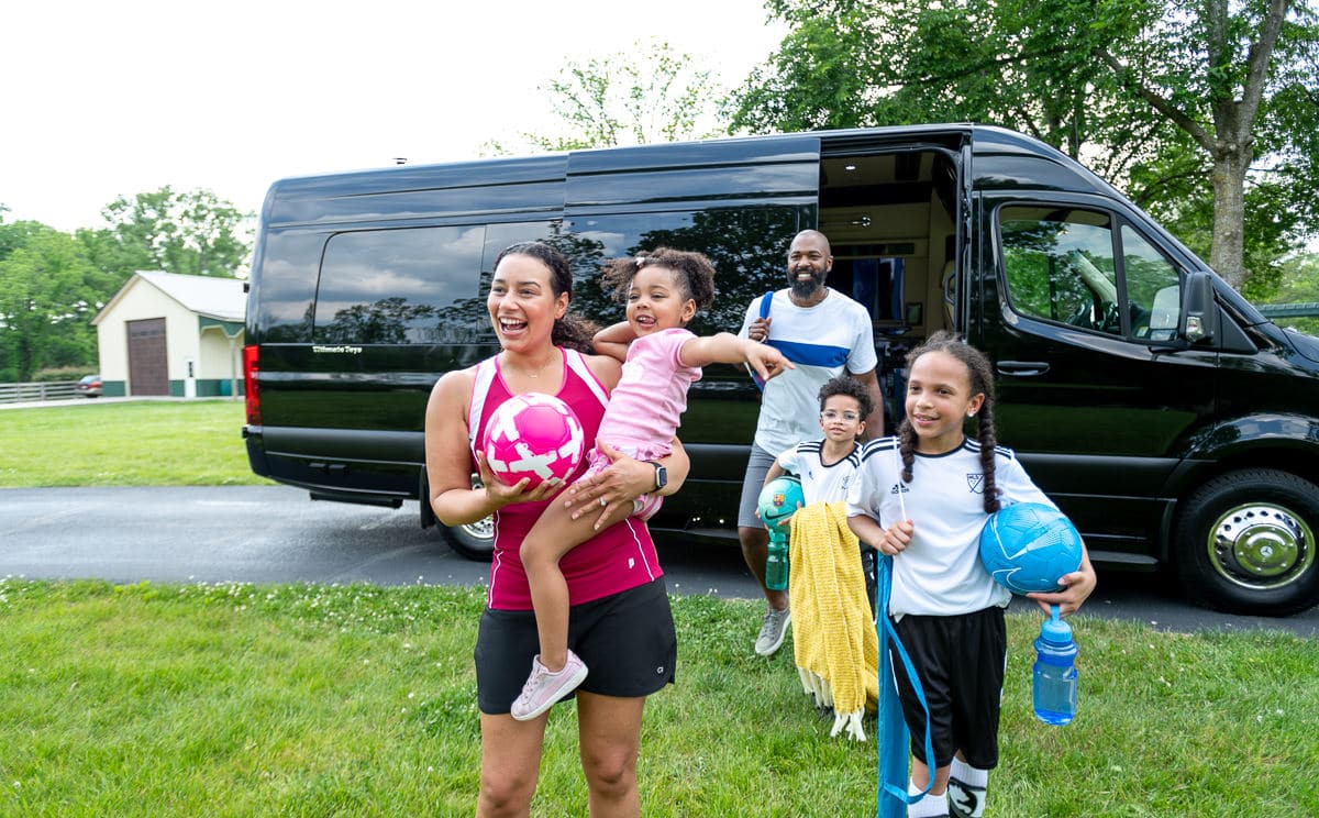 Sprinter with kids going to soccer