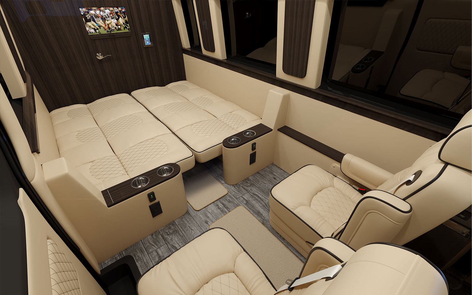 image showing the two sofas converted into a queen-sized bed in our luxury travel van