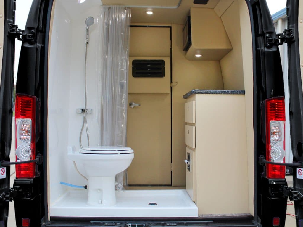 rear bathroom and kitchen in the Ultimate Rover, custom Dodge RV