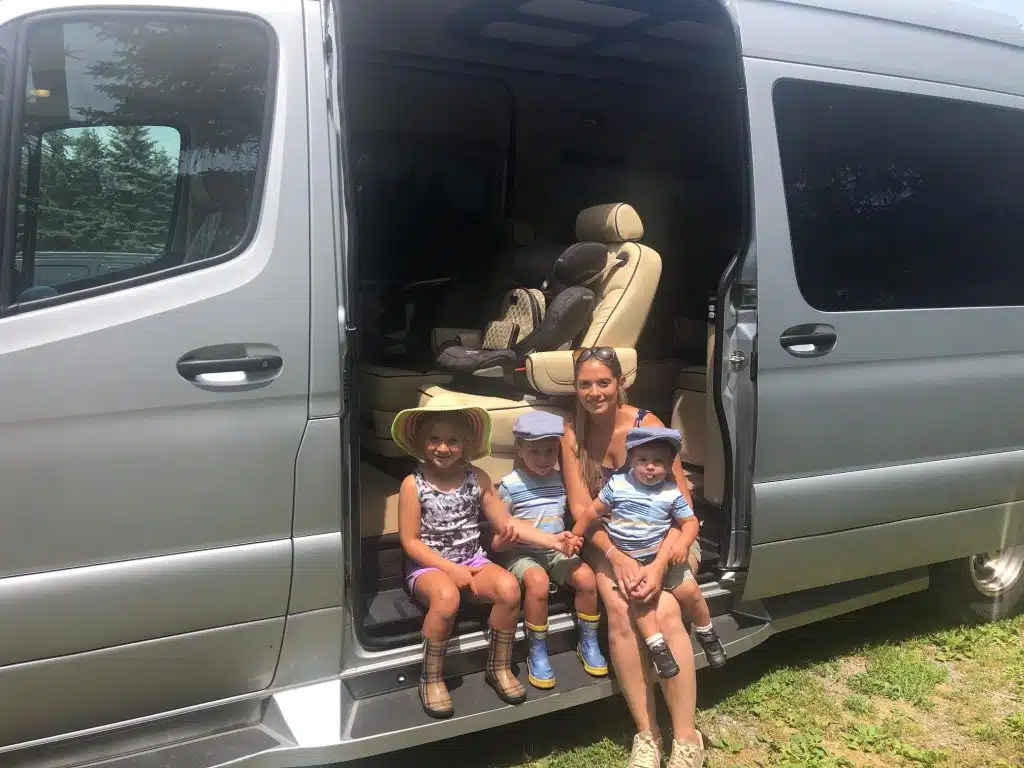 family posing in their custom mercedes van
