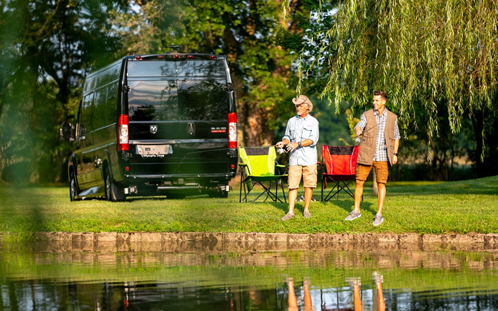 Father and son fishing next to their new Ultimate Voyager