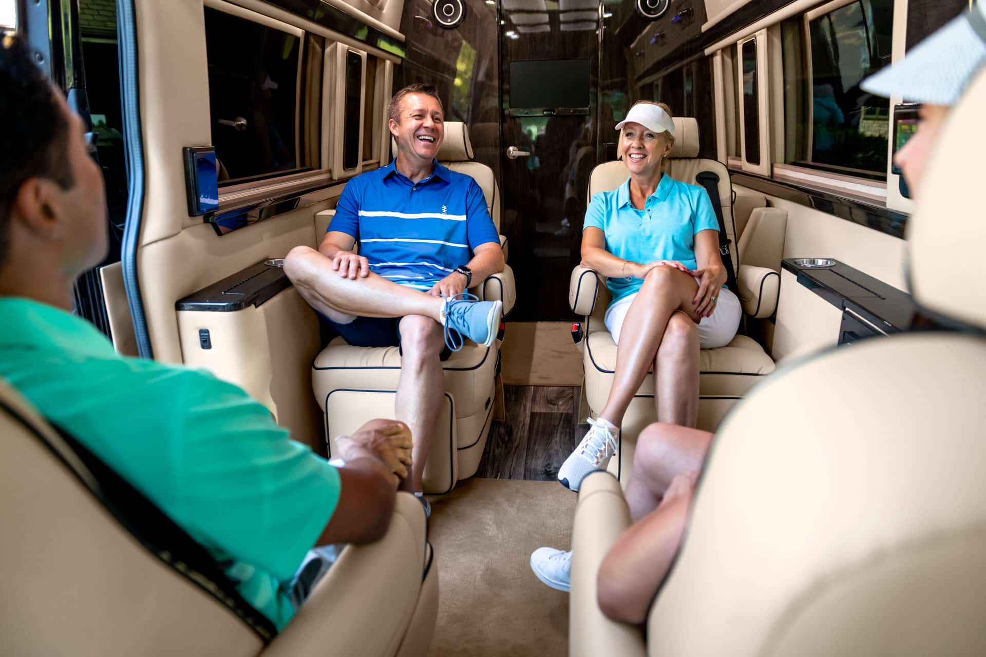 people enjoying the cabin in the Ultimate Coach
